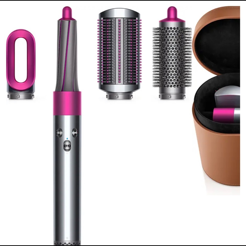 Dyson hair styler with all attachments and case.